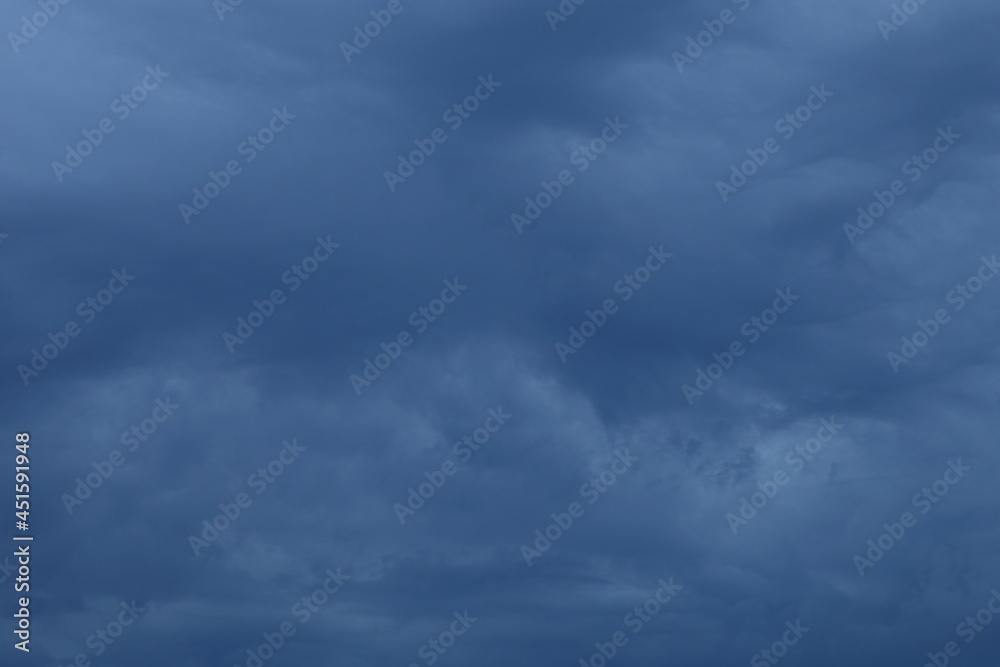 Dramatic stormy gray blue sky closeup with Heavy clouds at summer evening, beautiful cloudscape view, scenic texture for background and wallpaper