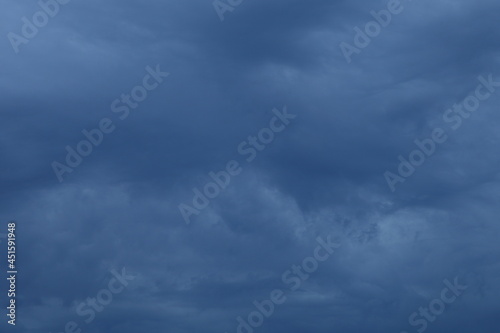 Dramatic stormy gray blue sky closeup with Heavy clouds at summer evening, beautiful cloudscape view, scenic texture for background and wallpaper
