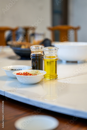 Seasoning combination on the hotel table, soy sauce, edible oil, chili perilla