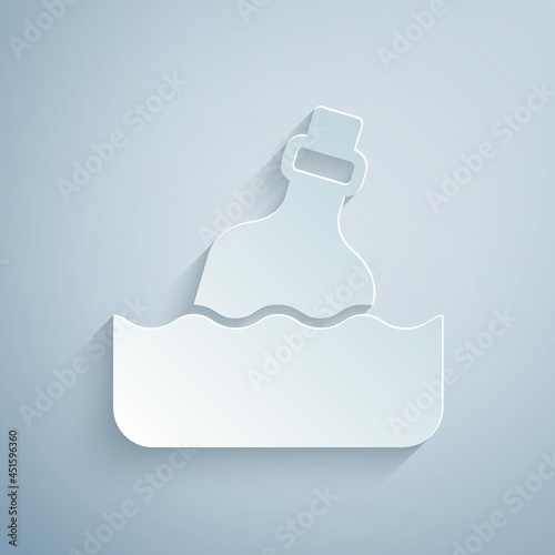 Paper cut Glass bottle with a message in water icon isolated on grey background. Letter in the bottle. Pirates symbol. Paper art style. Vector