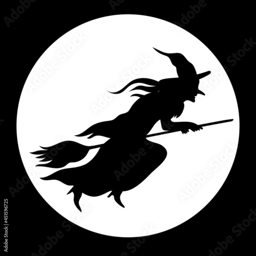 black silhouette of a witch flying on a broom on the full moon background.