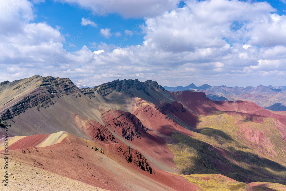 Fototapeta premium Rainbow Mountain, is a mountain in the Andes of Peru with an altitude of 5,200 metres above sea level. It is located on the road to the Ausangate mountain.