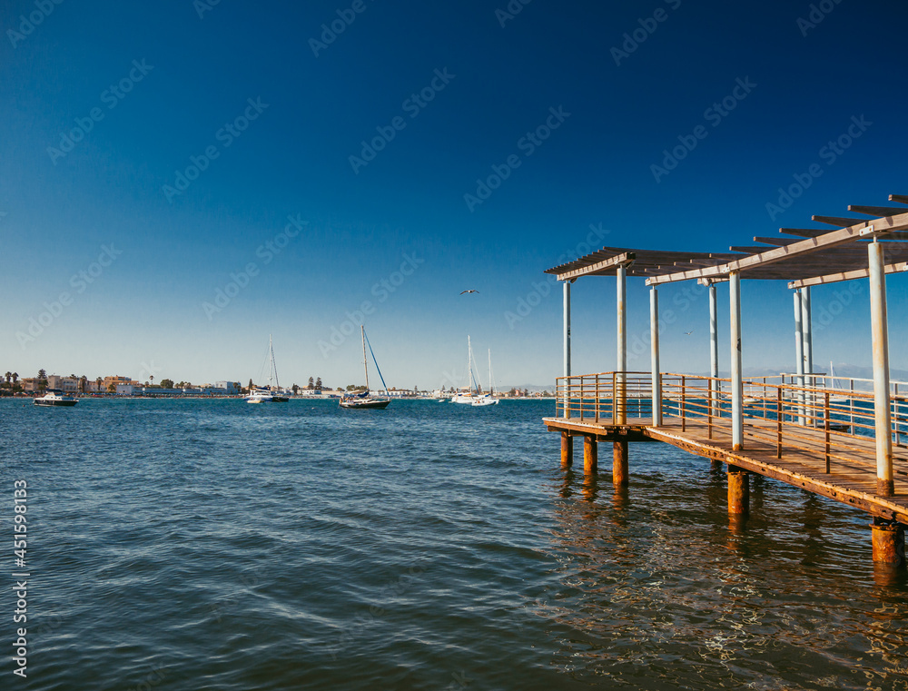 long wooden quay on the sea towards the horizon