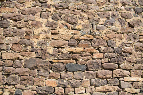 Wall made of river stones fastened with lime mortar
