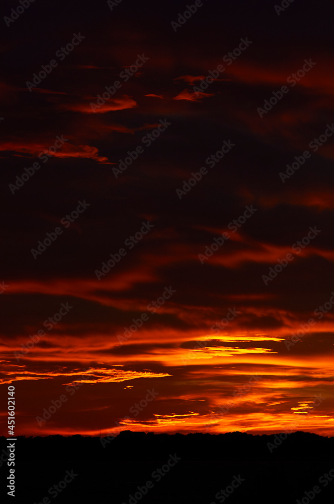 Red clouds at sundown like a burning sky of a spectacular sunset from La Savina (Formentera, Pityusic Islands, Balearic Islands, Mediterranean sea, Spain)