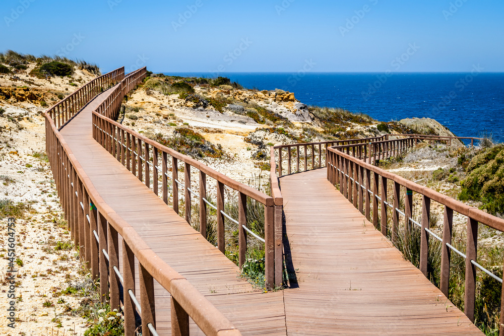 Obraz premium Wooden walkways by the Atlantic Ocean in Zambujeira Do Mar, Alentejo, Portugal