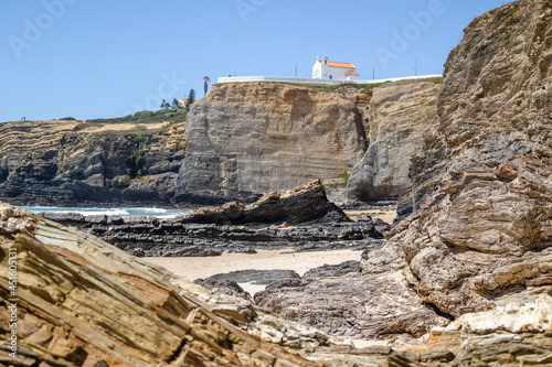 Cliffy beach in Zambujeira Do Mar, Vincentina Coast Natural Park, Alentejo, Portugal photo