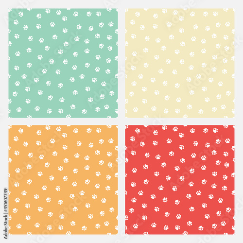 Fototapeta Naklejka Na Ścianę i Meble -  Set of 4 colorful seamless patterns with white paws.