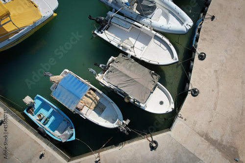 Aerial drone view of fishing boats moored at the marina. Agia triada Paralimni Cyprus © Michalis Palis