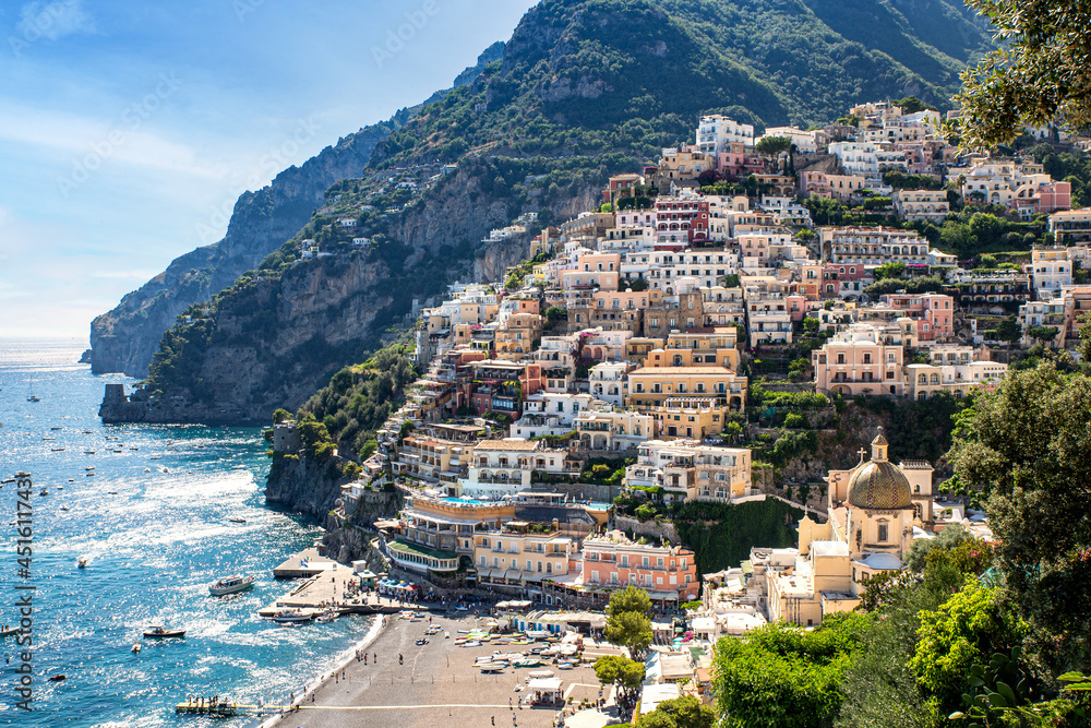 Scenic view of Positano overlooking the beach and the blue sea on the Amalfi Coast in Campania, Italy.
