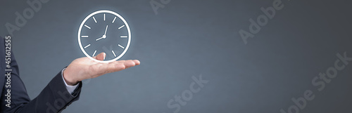 Businessman holding clock. Business time management. business time is money. banner, copy space. Businessman showing clock.
