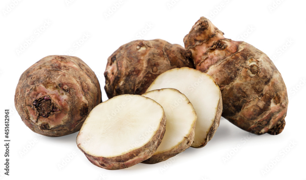 Jerusalem artichoke whole and slices on a white background. Isolated Jerusalem artichoke whole and slices on a white background. Isolated
