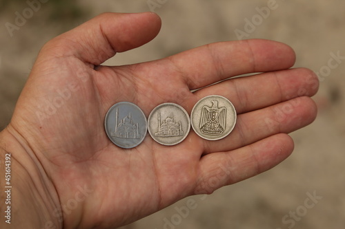 Old arab coins in hand