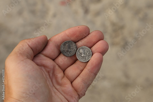 Photos Two ancient coins of greek colonies in hand