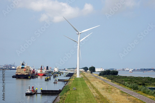 Wind turbine in a landscape of the harbor Europort of Rotterdam photo