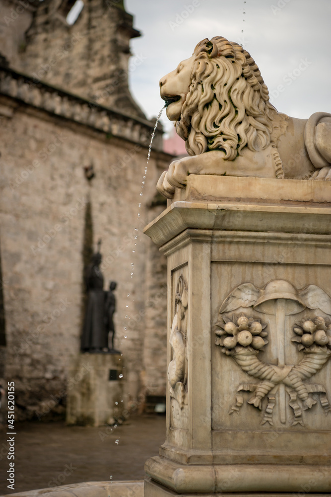 lion statue at the entrance of a church in havana cuba