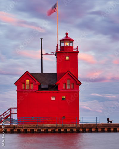 Big Red Lighthouse at the entrance to Macatawa lake and bay on Lake Michigan photo