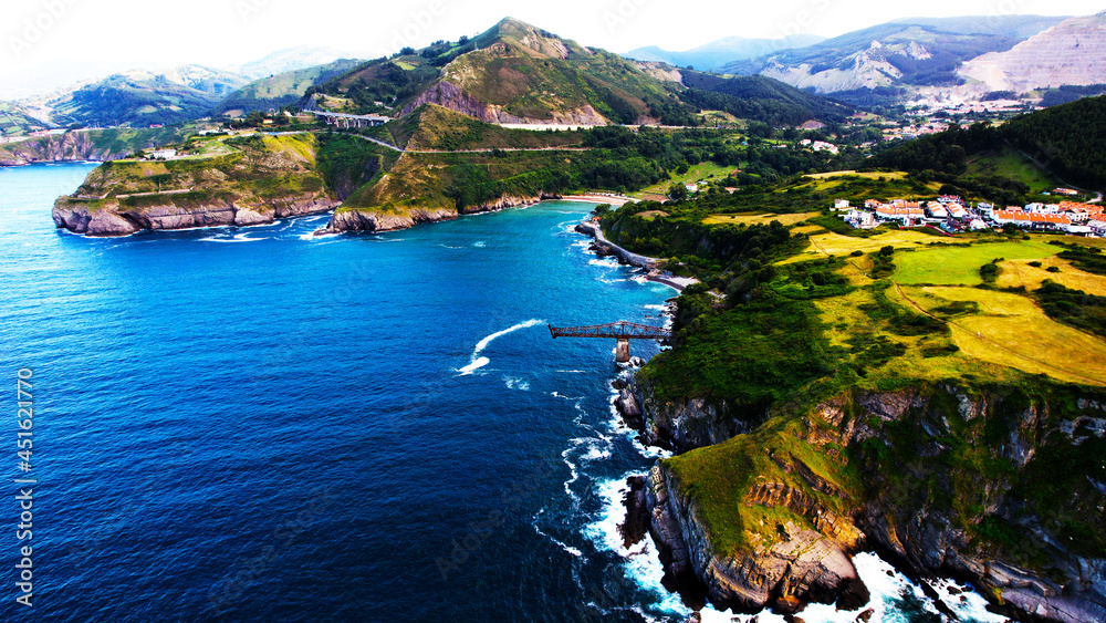 Obraz premium In this imagen you can see Castro Urdiales, and dicido´s charger. This charger is ubicated in the cliffs of the town. Castro Urdiales is a city ubicated in Cantabria, Spain. 