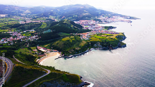 In this imagen you can see Castro Urdiales, and dicido´s charger. This charger is ubicated in the cliffs of the town. Castro Urdiales is a city ubicated in Cantabria, Spain.  photo