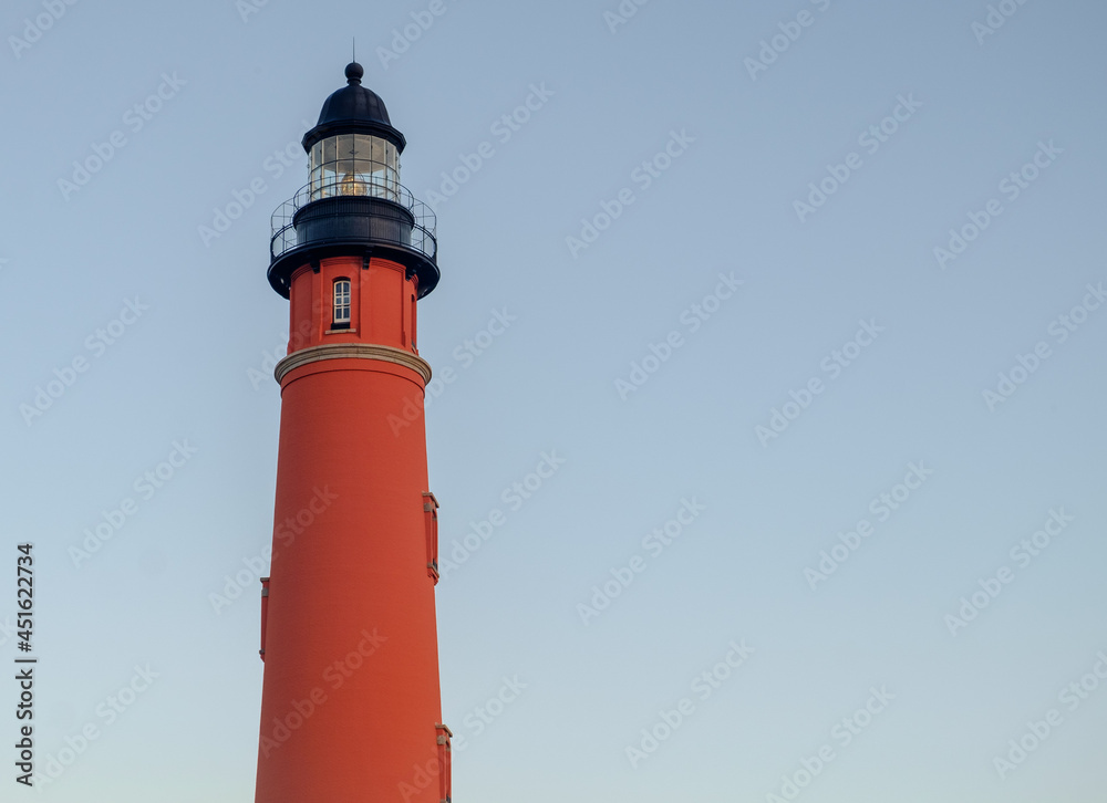 Sunrise on the ornate and beautiful Ponce Inlet Lighthouse on the Florida Coast Sunrise on the ornate and beautiful Ponce Inlet Lighthouse on the Florida Coast