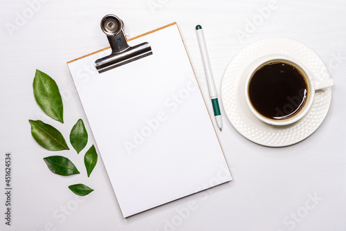 Work notebook with a mug of coffee