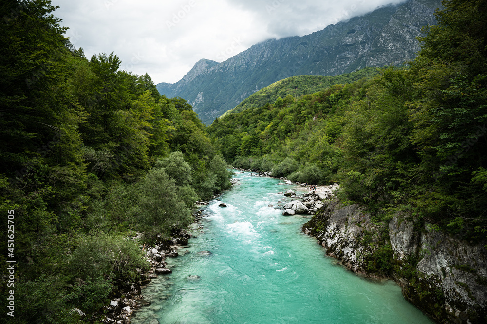 Blue Soča river with crystal clear water in the Soča valley (Slovenia) Blue Soča river with crystal clear water in the Soča valley (Slovenia)