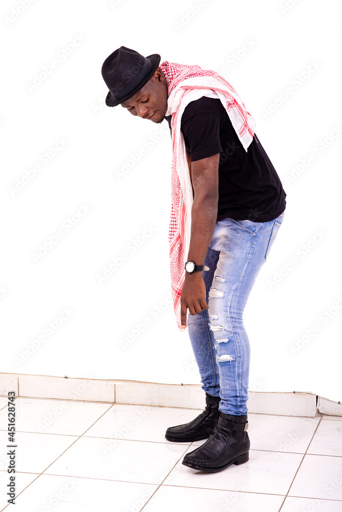 Naklejka premium handsome young african man pointing finger down.