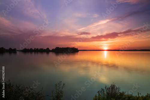 Lake Musov - South Moravia - Czech Republic. Calm water at sunset. Beautiful clouds in the sky. © Roman Bjuty