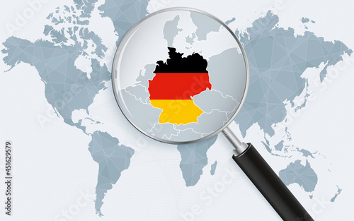 World map with a magnifying glass pointing at Germany. Map of Germany with the flag in the loop.