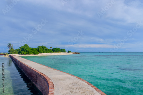 Fototapeta Naklejka Na Ścianę i Meble -  The brick moat around Fort Jefferson with the crystal clear waters of the Gulf surround it