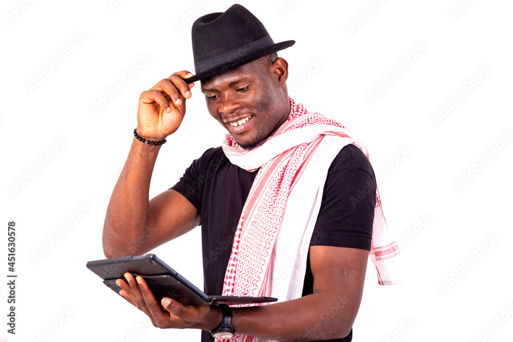 young man holding digital tablet smiling. young man holding digital tablet smiling.