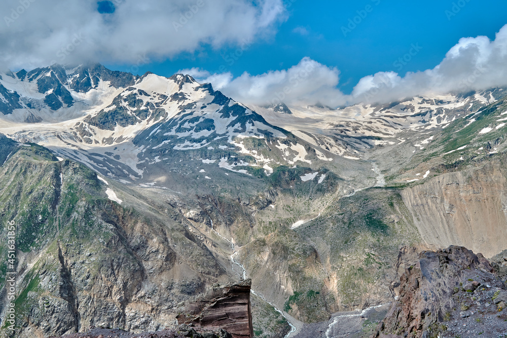 view of the Caucasus mountains and peaks covered with snow