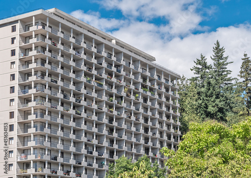 Photography Back side of apartment residential building on blue sky background