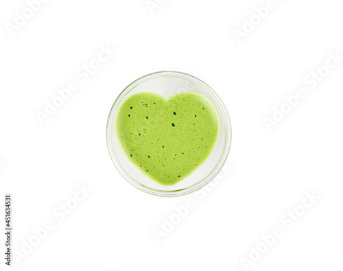 Heart shaped cup of green matcha latte tea isolated on white