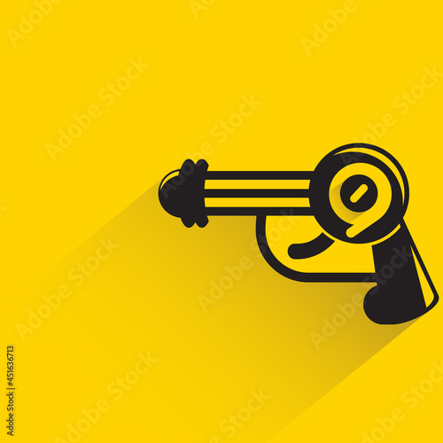 space blaster gun or fantastic raygun icon on yellow background