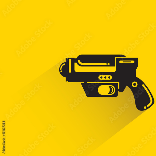 space blaster gun or fantastic raygun icon on yellow background