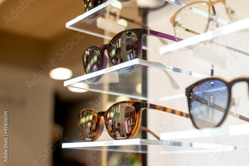  Different eyeglasses on the table in the eyewear shop © MarcoLatino
