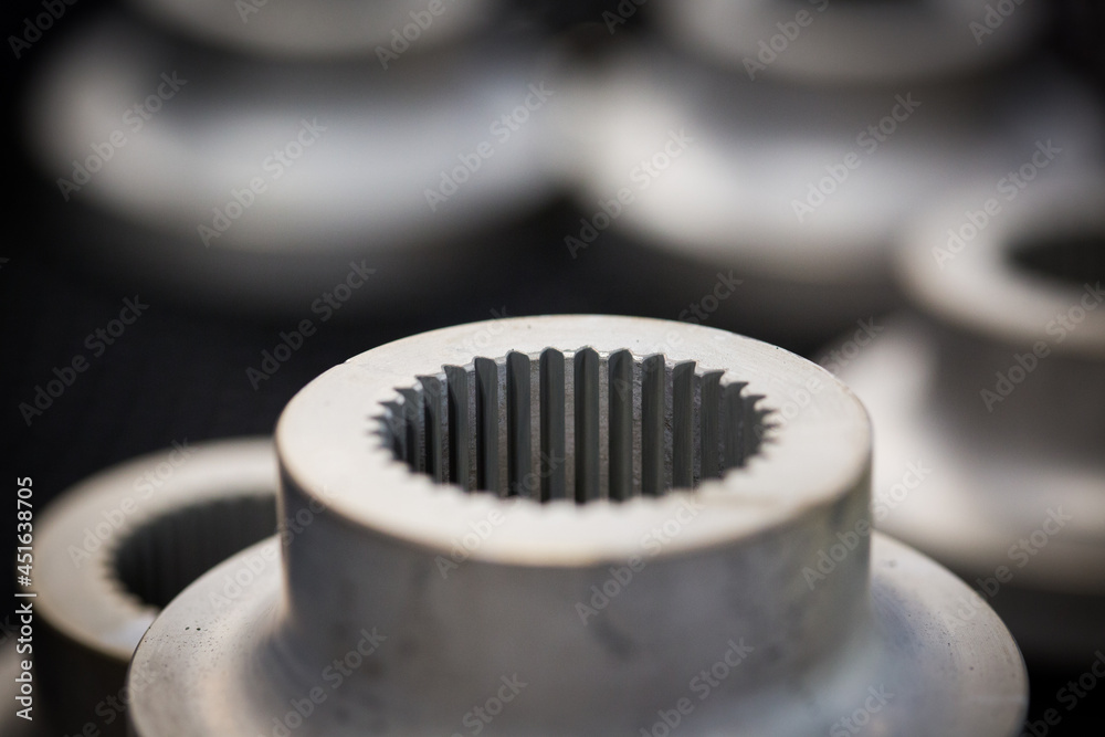 Circular machine part made of steel in a manufacturing plant Circular machine part made of steel in a manufacturing plant