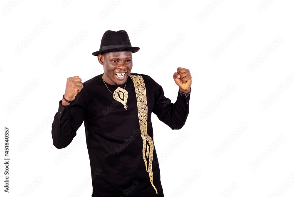 young happy man making a winning gesture. young happy man making a winning gesture.