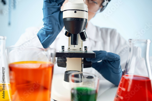 woman scientist laboratory microscope research