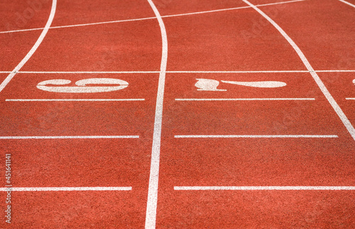 Running Track. Red treadmills at the stadium.Red racetracks on the sports arena. Stadium.