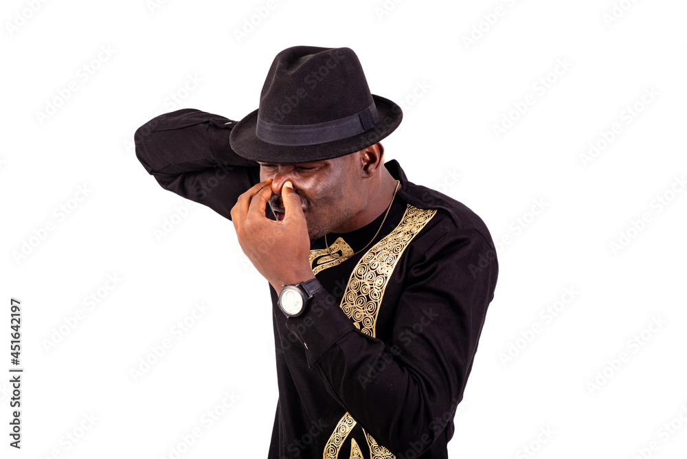 young man closes nose with fingers. young man closes nose with fingers.
