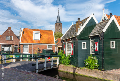 Canal, bridge and the church of Volendam, old fishing village in North Holland, The Netherlands