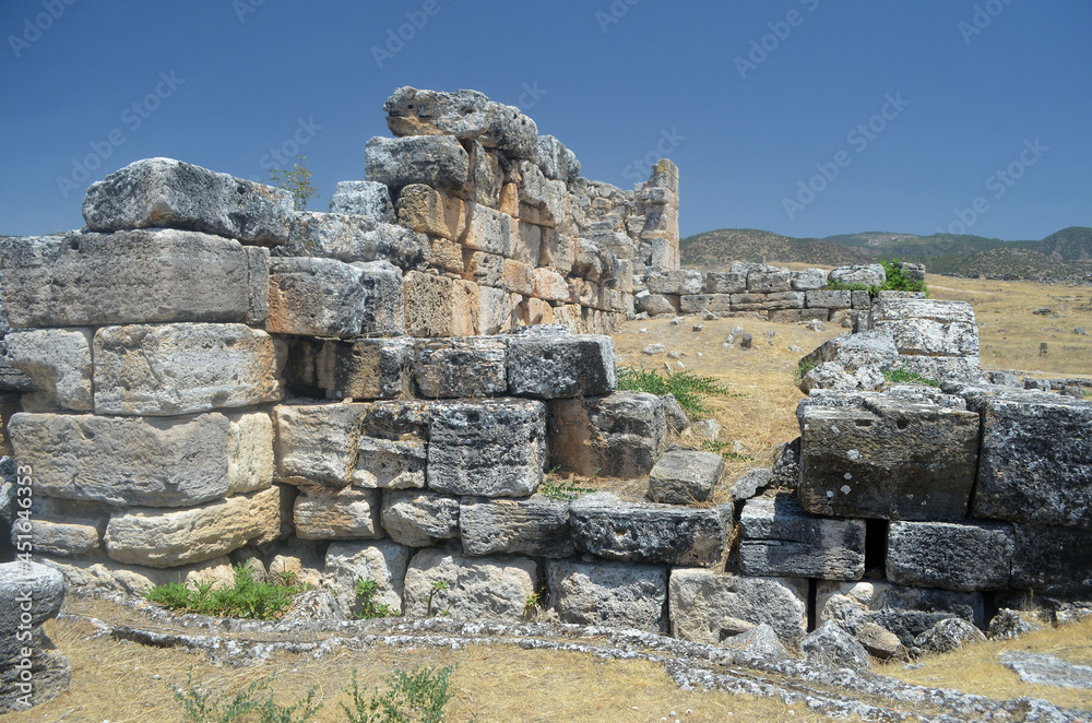 Ruins of ancient column and construction blocks of antique city Hierapolis, in Pamukkale, Turkey
