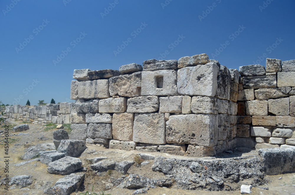 Ruins of ancient column and construction blocks of antique city Hierapolis, in Pamukkale, Turkey
