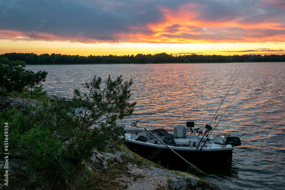Naklejka premium Fisherman lake sunset in summer season