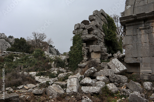 stone and marble debris of ancient abandoned city Termessos lost in Turkey mountains
