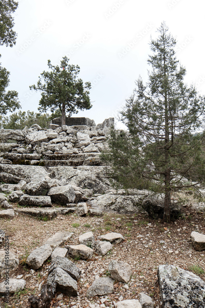 stone and marble debris of ancient abandoned city Termessos lost in Turkey mountains