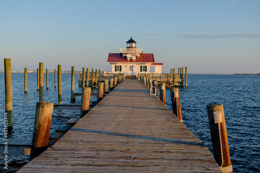 Fototapeta premium The Beautiful Roanoke Marsh Lighthouse located on the Outer Banks of North Carolina at sunset