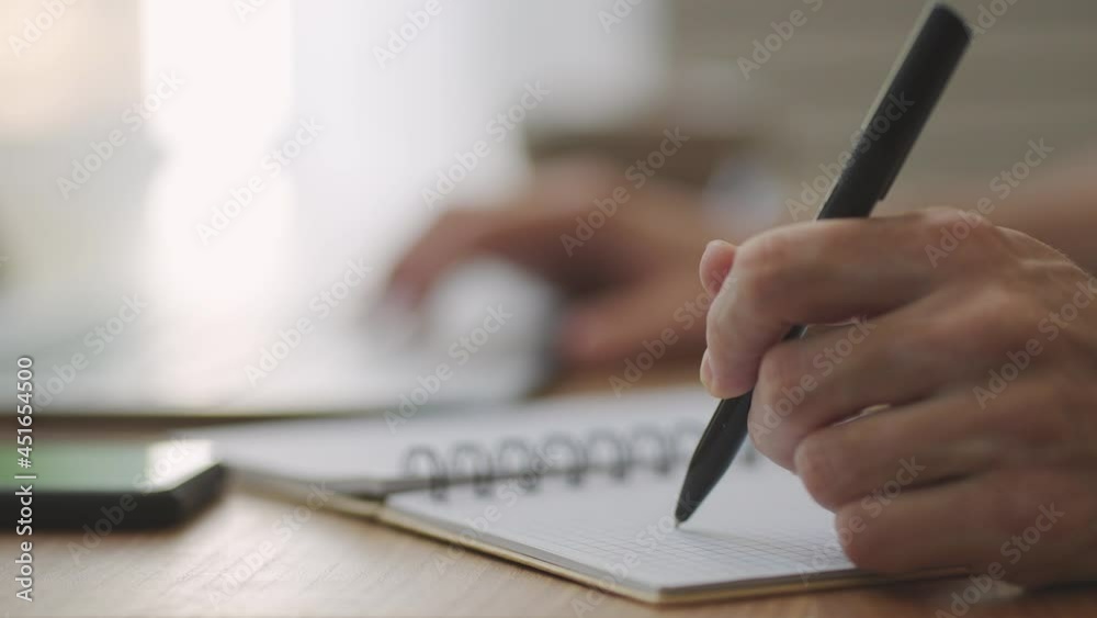 businessman holding pen writing new appointments information in organizer concept, mixed race male hands making notes in personal paper planner at desk, Learn about the stock and investment market businessman holding pen writing new appointments information in organizer concept, mixed race male hands making notes in personal paper planner at desk, Learn about the stock and investment market